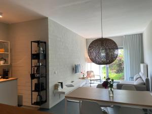 a living room with a table and a dining room at Ferienwohnung ZWEI Hof Himmelgrün in Saal +30 photos