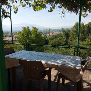 a table and chairs on a balcony with a view at Studio Relax in Travnik