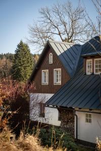 a house with a metal roof on top of it at Bedřichov U Nás in Bedřichov