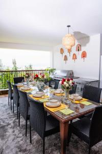 a dining room with a table and chairs at Hilltop Lakeview in Munyu
