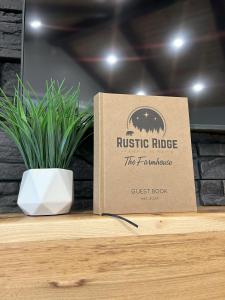 a box sitting on a table with a potted plant at The Farmhouse at Rustic Ridge in Benzonia