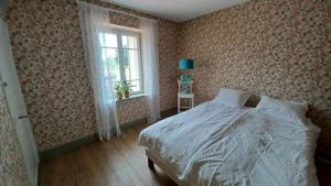 Ένα ή περισσότερα κρεβάτια σε δωμάτιο στο Maison Myran