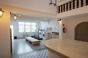 a kitchen with two washer and dryers in it at Surachet at 257 Boutique House in Phuket