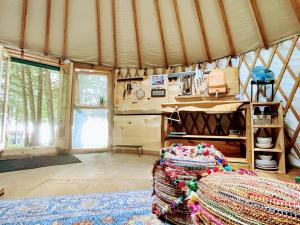 a room with a yurt with a bed in it at Waterfront CedarGrove Yurt-Glamp in Red Bay