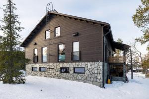a house in the snow in the winter at Stay North - Utsunkajo in Kittilä