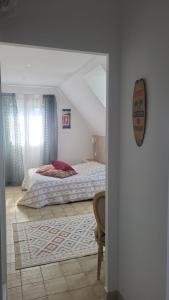 Postel nebo postele na pokoji v ubytování La Maison