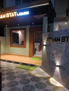 a lobby of a building with a sign that reads hammission at Dream Stay Lodge in Guwahati