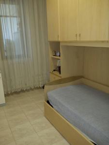 מיטה או מיטות בחדר ב-Casa Vacanza via Paoli