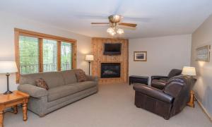 a living room with a couch and a fireplace at Wilder Inn in Ephraim