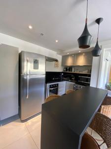 Kuchyň nebo kuchyňský kout v ubytování Apartamento Itaipava Granja Brasil