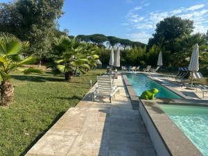 a swimming pool with a toy in the middle of it at Escape to Comfort, Relax, and Love in Rome - Luxury Agriturismo 5 Suites in La Giustiniana