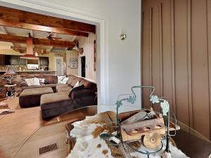 a living room with a couch and a table at Casa Devine View in Ruidoso +16 photos