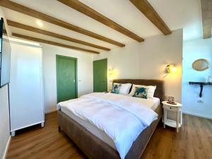 a bedroom with a large bed in a room at Casa Valentina in Piran
