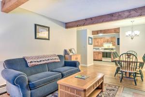 a living room with a couch and a table at 1 Mi to Attitash Mountain: Condo w/ Resort Perks in Bartlett