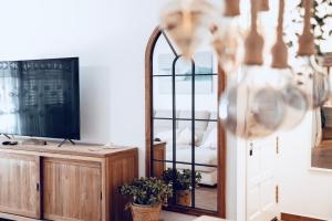 a mirror and a dresser in a room at Casa Oceanchild - Terraza con Vista Mar, Morro Jable in Morro del Jable
