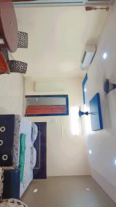 a room with a room with a bed and a room with a room at Sunrise beach resort perupalem in Perupalem