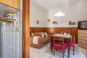 TV a/nebo společenská místnost v ubytování Italian Experience-Verdeconero Apartment