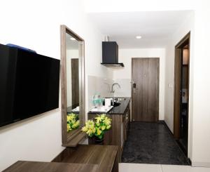 a bathroom with a sink and a mirror at Parkwood Elite in Bengaluru +32 photos