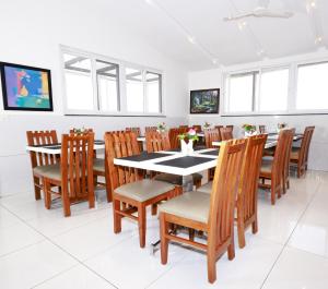 a dining room with a table and chairs at Parkwood Elite in Bengaluru