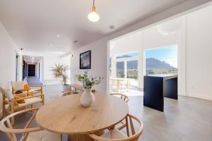 a dining room and living room with a table and chairs at Roam Tillamook in Garibaldi