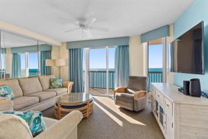 a living room with a couch and a tv at Ashworth 1709 in North Myrtle Beach