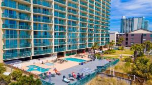 an aerial view of a large apartment building with a pool at Ashworth 1709 in North Myrtle Beach