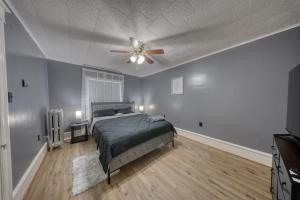 a bedroom with a bed and a ceiling fan at 1-Bedroom, 1-Bath Getaway in Carbondale +9 photos