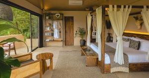 a bedroom with a bed with a canopy at Hotel Casa Candela in San Jerónimo