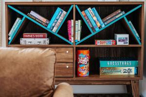 a book shelf filled with lots of books at Basecamp151 in Afton