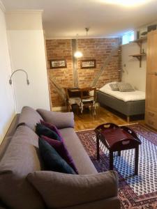 a living room with a couch and a table at Dahmskahuset in Kalmar