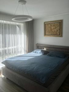 Postel nebo postele na pokoji v ubytování Hipodromo street Palanga