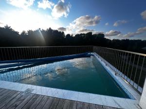 a swimming pool on the deck of a house at Hipodromo street Palanga in Palanga