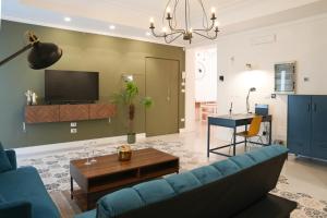 TV a/nebo společenská místnost v ubytování Le porte di Lecce Suites