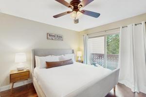 a bedroom with a bed and a ceiling fan at Beaver Creek Bungalow in Edwards
