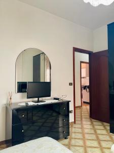 a bedroom with a desk with a computer on it at Margiò in Giardini Naxos +9 photos