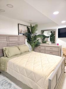 a bedroom with a large bed and a large mirror at Vessel Hotel Studio Suites of Atlanta, GA in Atlanta +9 photos