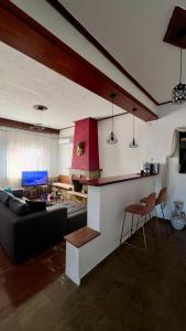 a living room with a couch and a table at Edem House - Volos Greece in Volos