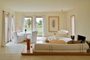 a living room with a white couch and a table at Son Gener Hotel Spa in Son Servera +84 photos