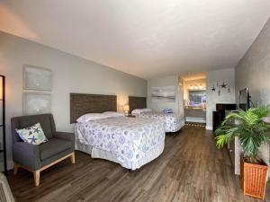 Ένα ή περισσότερα κρεβάτια σε δωμάτιο στο Bonita Beach Inn & Suites +58 φωτογραφίες
