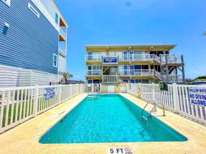 a swimming pool in front of a building at Grand Strand Resort II 18 in North Myrtle Beach
