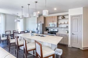 a kitchen with a large island in the middle of a room at The Pointe 3-341 in Inlet Beach