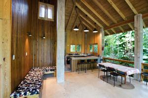 a large room with a table and chairs in it at Indómito Chalet-El Yunque Zone in Juncos