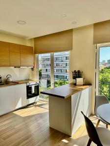 Kuchyň nebo kuchyňský kout v ubytování Alagoas Studio - City Center