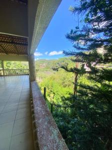 a view from the outside of a building with trees at Pousada Padre Kiliano in Pacoti
