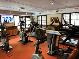 a gym with treadmills and exercise bikes in a room at Résidence Les Arcs 1950 Le Village - maeva Home - Appartement 3 pièces 6 personnes vue sur le Mont Blanc - Prestige - super Home MAE-4490 in Bourg-Saint-Maurice