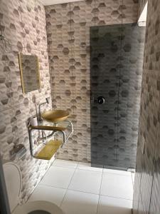 a bathroom with a sink and a shower at Hotel São João in Itaituba