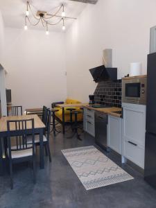 a kitchen with a table and chairs and a kitchen with a stove at APARTAMENTO CÉNTRICO - Tetuan - RH Santander 3B in Santander +24 photos