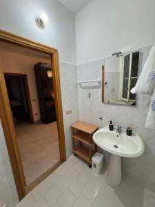 a bathroom with a sink and a mirror at Borgo Antico Satriano in Satriano +15 photos