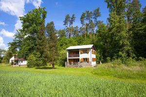 a house in the middle of a field at Chata Bory in Klenovice