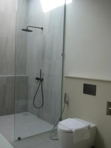 a bathroom with a shower and a toilet at Pinepilla Poolvilla Huahin in Hua Hin +21 photos